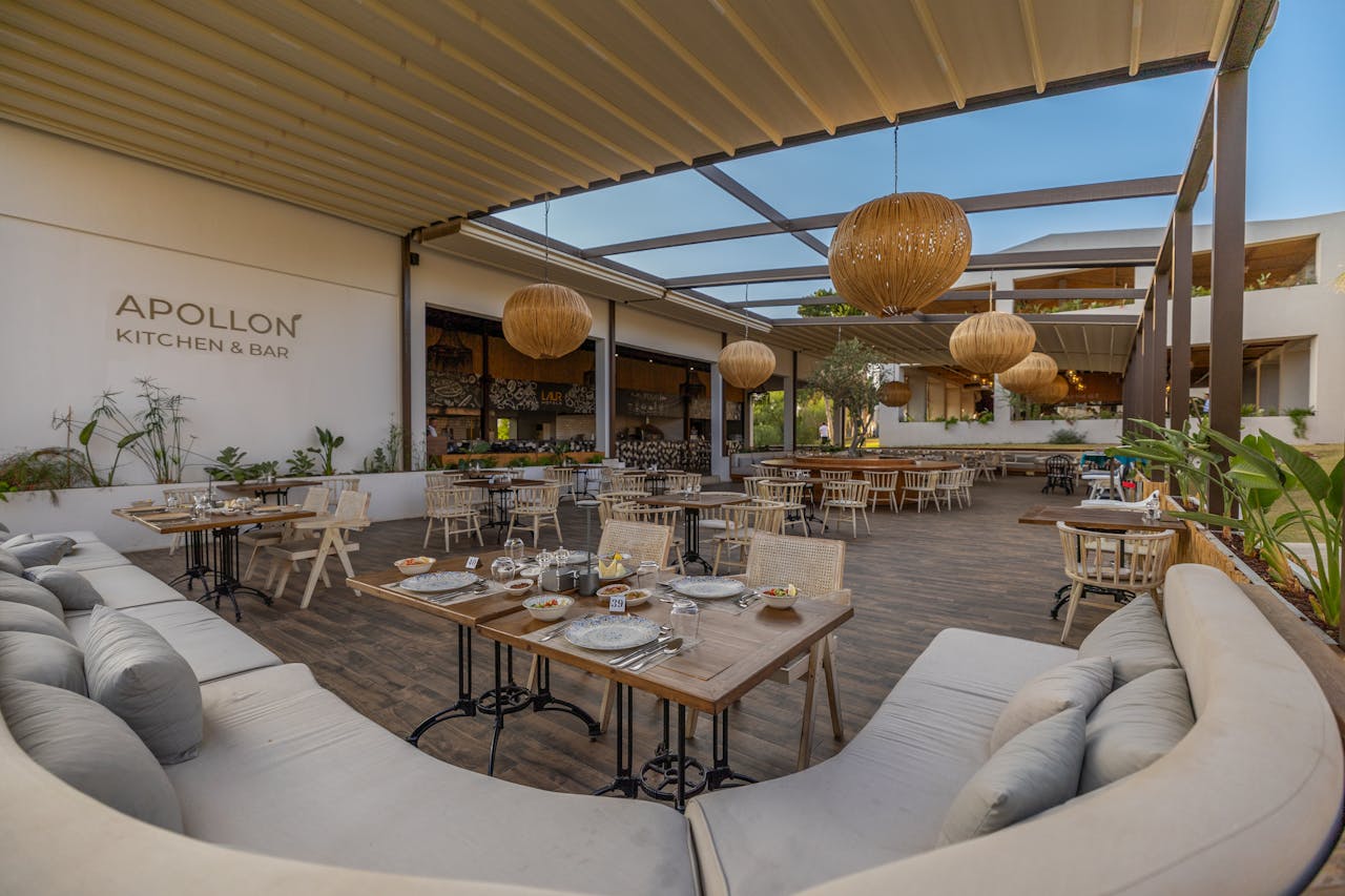 Experience elegant outdoor dining at Apollon Kitchen & Bar in Didim, Türkiye, with stylish decor and ambiance.